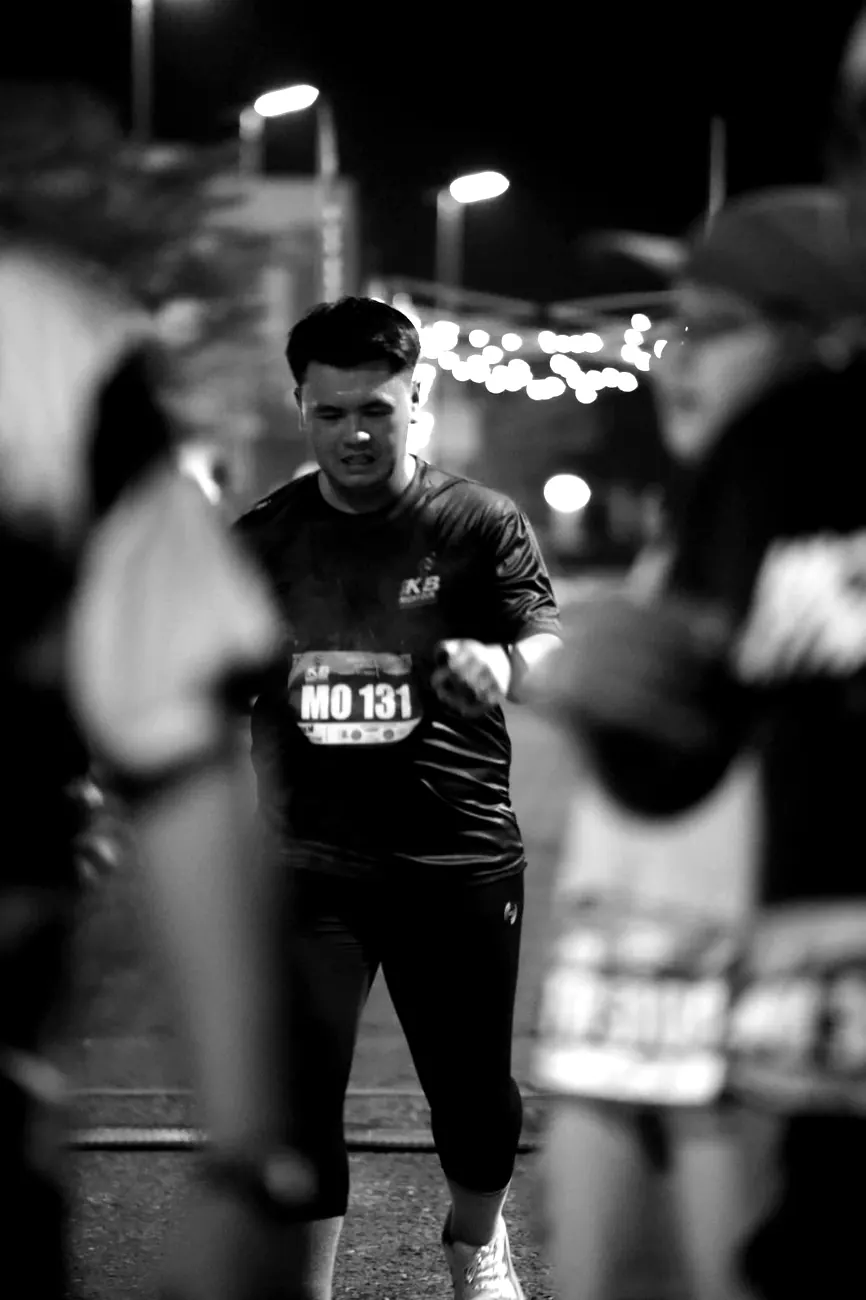 A crew runner in the final stretch of the KB Night Run